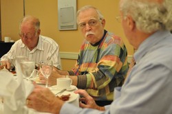 photo of three men eating