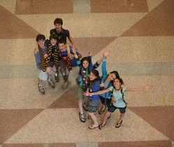 YAADS in a hallway waving