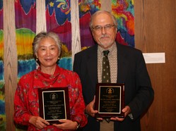 the Rev. Carol Chou Adams and the Rev. Dr. Daniel Adams receive awards for their 36 years of service 