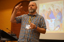Disciple Making Conference presenter B.J. Woodworth uses a well-known icon of the Trinity (behind him) to help Presbyterians imagine what it might be like to “participate in the divine nature of God.” 