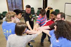 Rogers (one smiling – center of photo) enjoying a team building moment with other worship/production members at a planning meeting in March, for the 2016 Presbyterian Youth Triennium.