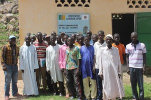 :  RELUFA coordinator Jeff Bamenjo (far left) with communities of Gozemey, North Cameroon, in front of their granary.