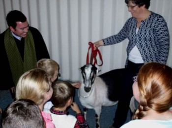 People with goat in church