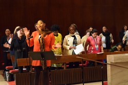 LaThelma Armstrong, one of the eleven young women who attended the Commission on the Status of Women through scholarship support from the Women’s Leadership Development & Young Women’s Ministries Office, leads attendees during a worship service.
