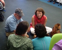 Presbyterians gather in small groups during the Big Tent workshop on Educate a Child.