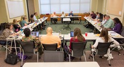 GACEIR committee members listen to an interfaith panel at their June 2015 meeting.