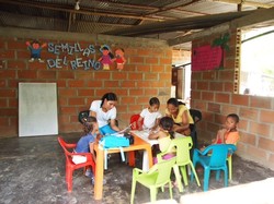 Children and teacher around a table
