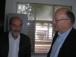 Cuban economist Osvaldo Hernandez (left) speaks with the Rev. Richard Hamm, executive director of Christian Churches Together in the U.S.