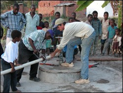 Jim McGill and Malawian colleagues work on one of the hand-dug wells that serve as a source of inexpensive and clean water. 