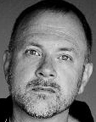 A black and white headshot of Bryan McFarland