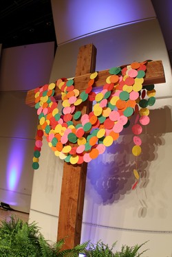 The garland of circles draped over the cross represent prayers for new creation and release. The Big Tent worship team prayed over every circle as they prepared them for worship.