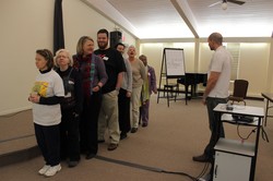 Bryce Wiebe (right) manager of Special Offerings, conducts an exercise with attendees of the Special Offerings Leader Support Network Ambassadors Training.