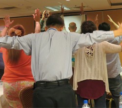 Conference goers felt Christ was with them as they participated in a body prayer.