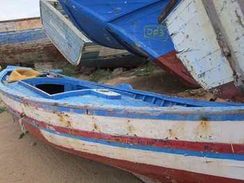 Abandoned boats that carried North African refugees to the shores of Italy.