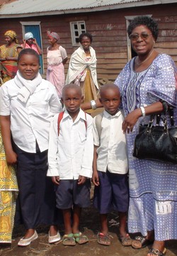 The Rev. Berthe Kalombo Nzeba with a rape survivor and her twin sons. 