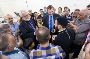 Peter Prove with displaced people at the parish hall of Serseng near Dohuk, Iraq.