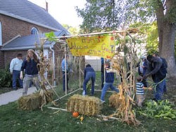 Children of Abraham members gather to build a sukkah and celebrate at Temple Beth El