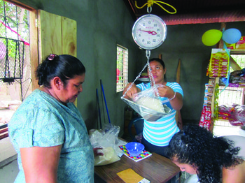 Rosario Munoz purchases basic items from Nueva Vida’s “Pacifico Grocery Store,” through which Pacific Presbytery is addressing root causes of poverty in Nicaragua.