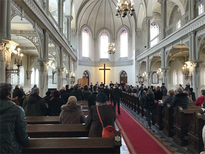 people worshiping inside of a church