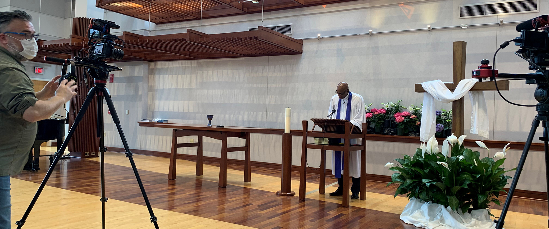 Videographer Mike Fitzer films the virtual Easter service with the Reverend Dr. J. Herbert Nelson, II, in the chapel of the Presbyterian Center in Louisville. Photo by Kathy Francis.