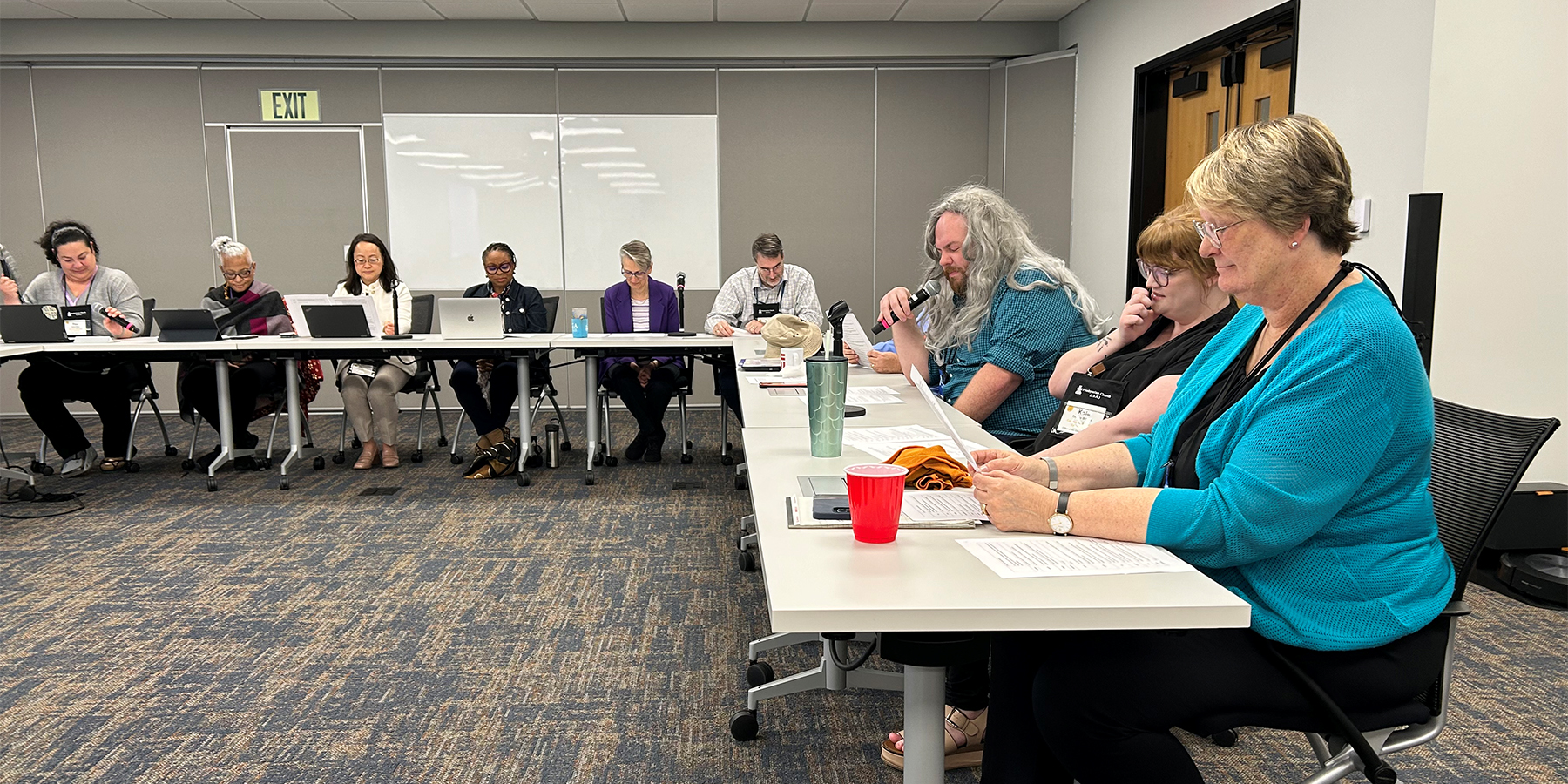 During a mock committee meeting offered up Tuesday, the Acting Stated Clerk of the General Assembly of the PC(USA), the Rev. Bronwen Boswell, kept tossing a flag to point out how and where committee members had gotten something not quite right. Photo by Mike Ferguson. 