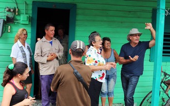 Jatibonico Mission members greet the IPRC/PCUSA delegation on Abel Perviez’ front porch. At right is IPRC moderator the Rev. Ary Fernandez.