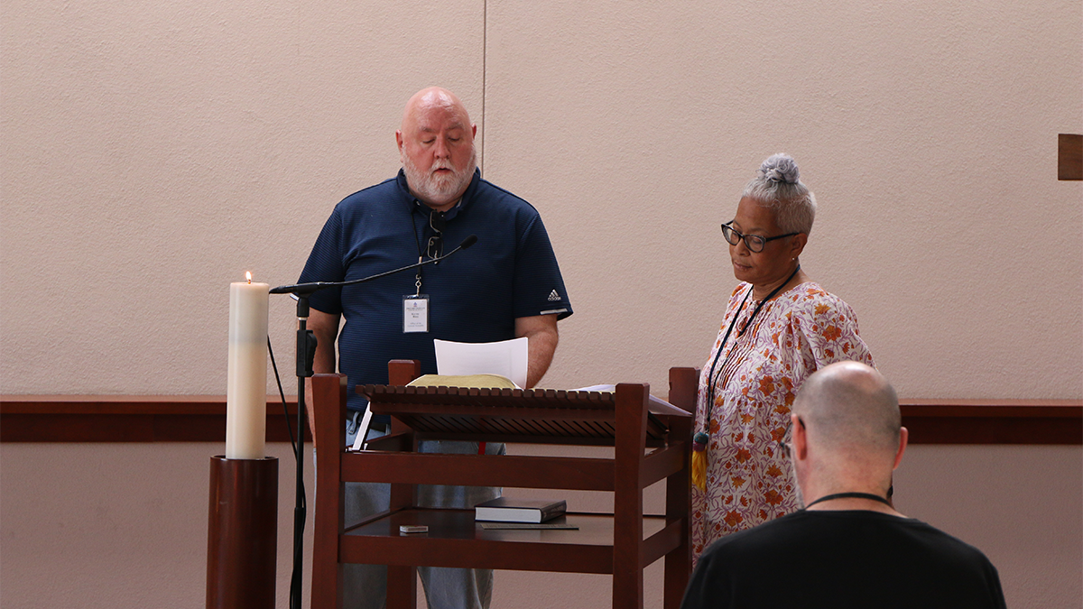 Kerry Rice, deputy stated clerk, and valerie izumi, manager of GA Nominations in the Office of the General Assembly, read scripture during the chapel service. Photo by Rick Jones 