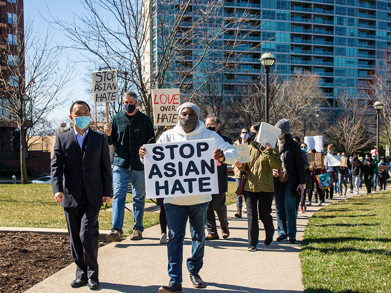 People participating in the The CommUNITY Collective, #StopAsian event, standing in solidarity against hate crimes, in Columbus, OH on March 20, 2021. Photo by Paul Becker licensed under CC BY 2.0)