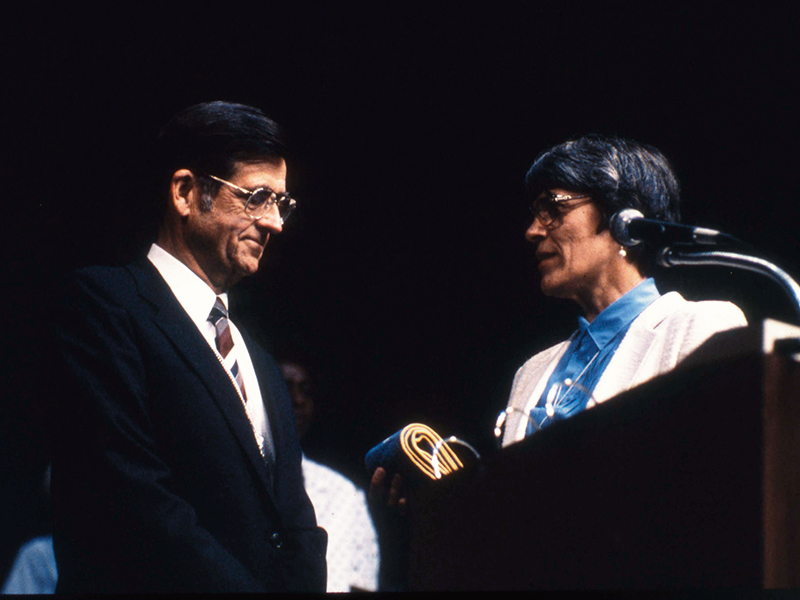 Harriet Nelson, Moderator of the 196th General Assembly (1984) of the PC(USA) presents symbols of the office to newly elected Moderator, Bill Wilson. Photo courtesy of the Presbyterian Historical Society.