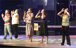 Youth perform on the stage of the 2010 Presbyterian Youth Triennium at Purdue University.